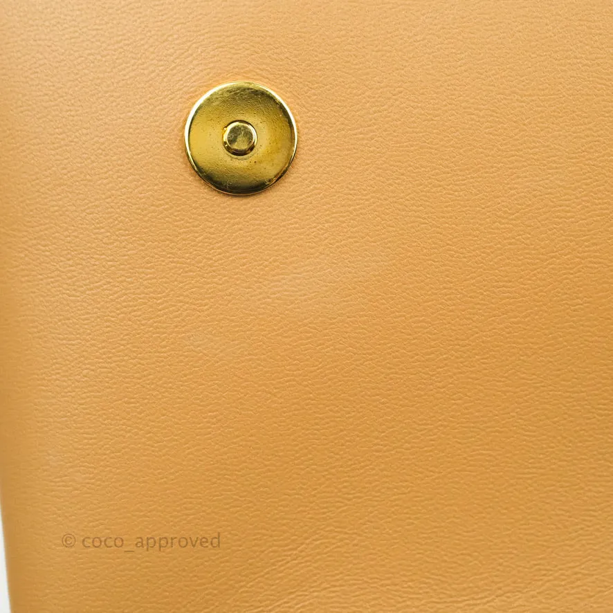 Louis Vuitton Pochette Coussin Monogram Caramel Beige Gold Hardware